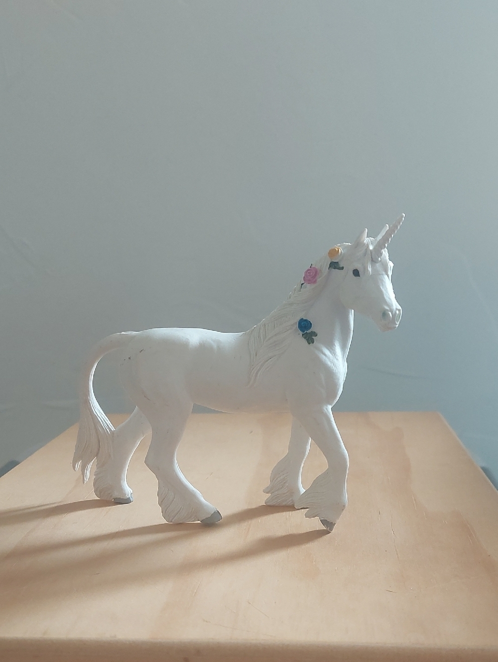 White Decorative Unicorn Figurine with Pastel Flower Accents